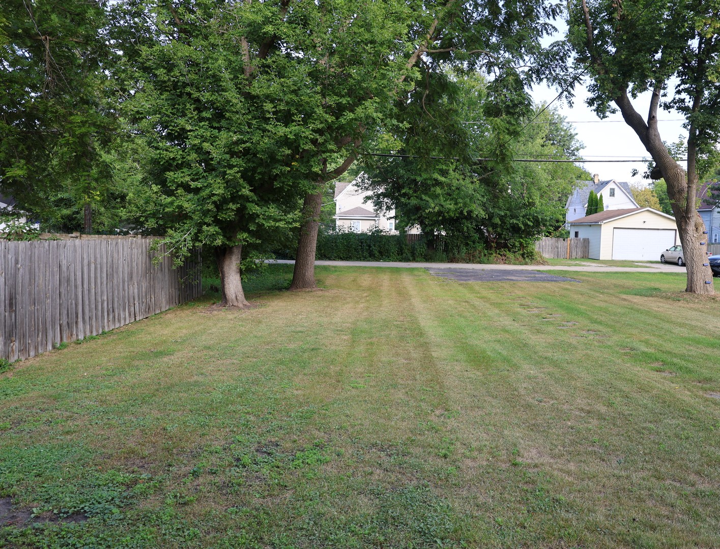 2911 Emmaus Avenue Zion, IL 60099 - Photo 28 of 28 a view of a yard with a house and large trees