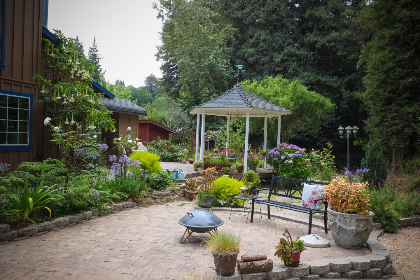 2007 Green Valley Road Watsonville, CA 95076 - Photo 4 of 52 a view of a chair and table in patio with a garden