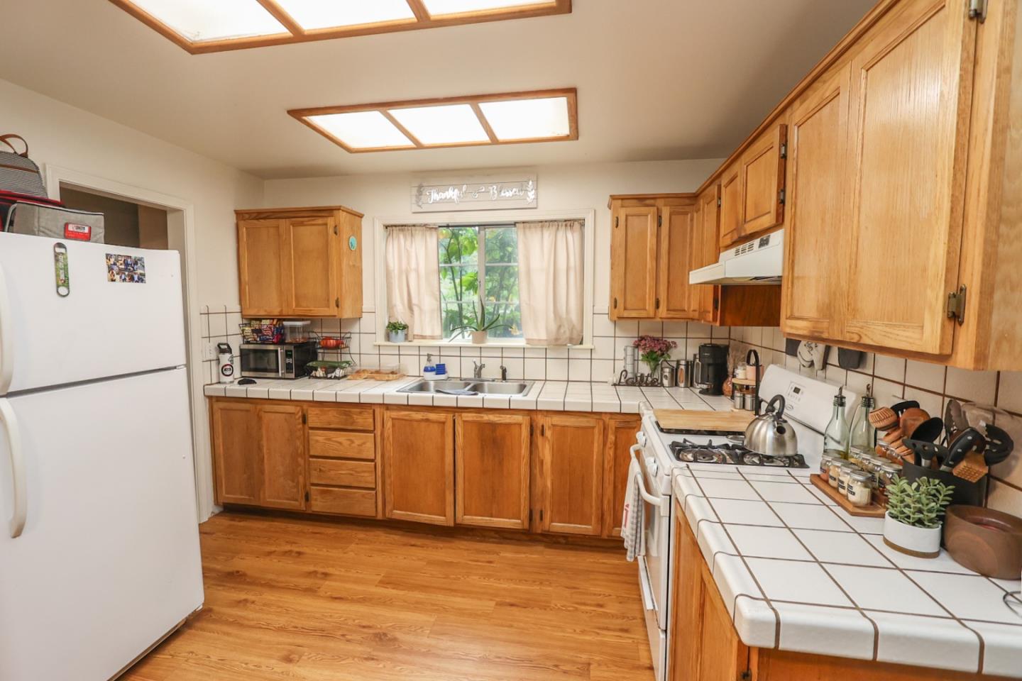 2007 Green Valley Road Watsonville, CA 95076 - Photo 46 of 52 a kitchen with stainless steel appliances granite countertop a stove a sink dishwasher a refrigerator and a stove
