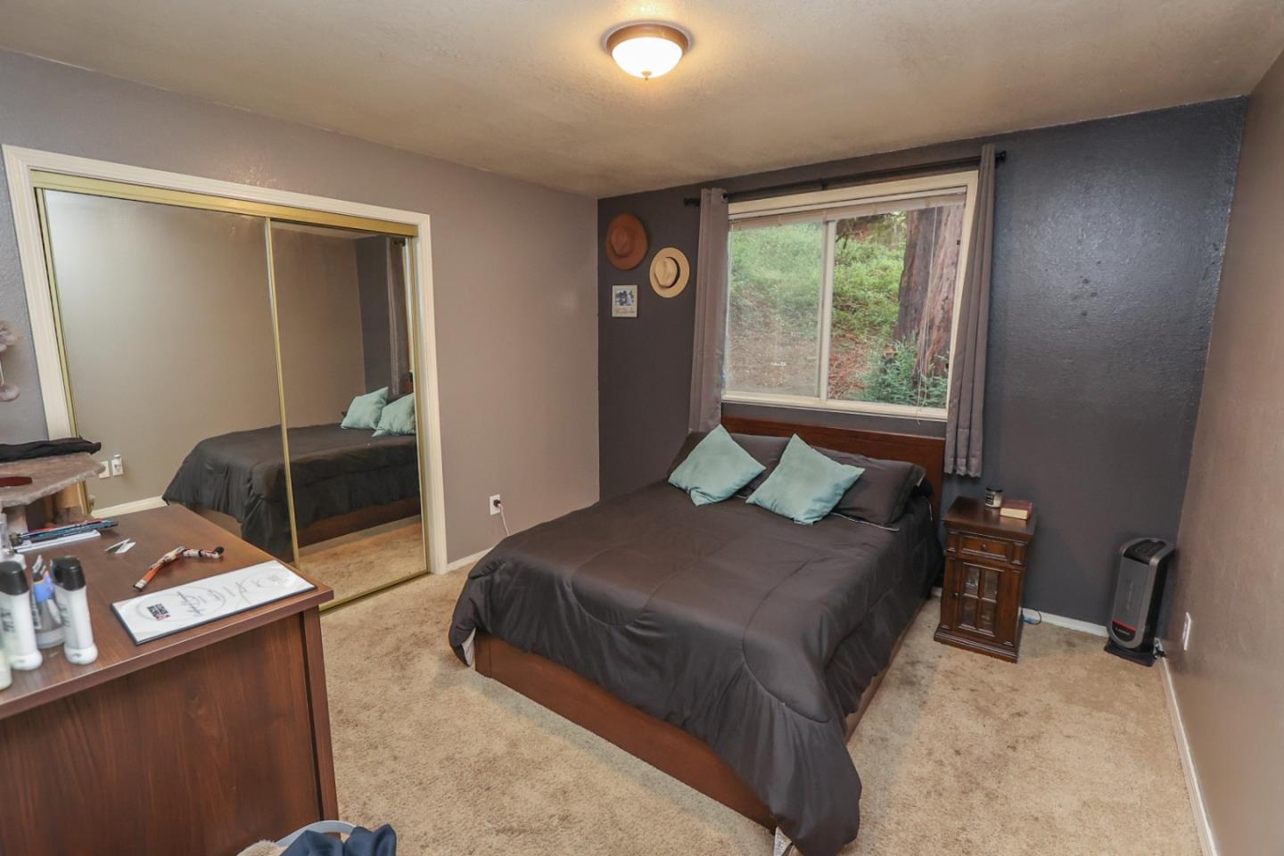 2007 Green Valley Road Watsonville, CA 95076 - Photo 47 of 52 a bedroom with a bed and wooden floor