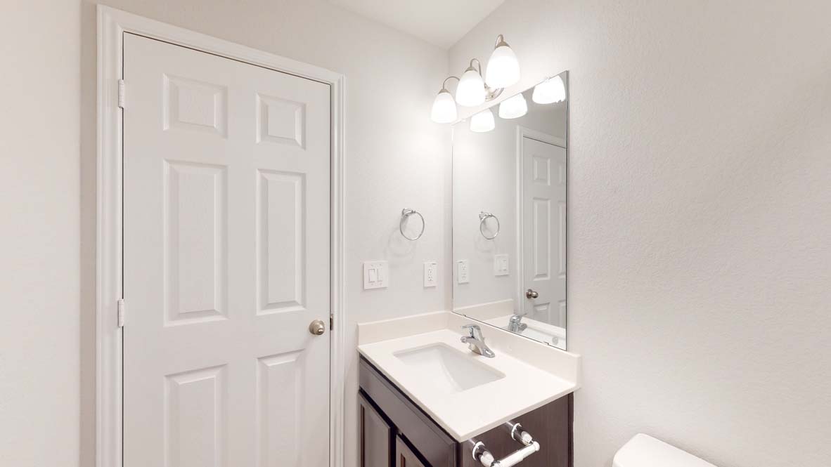 300 Creekfall Road Burnet, TX 78611 - Photo 19 of 23 a bathroom with a sink vanity and a mirror