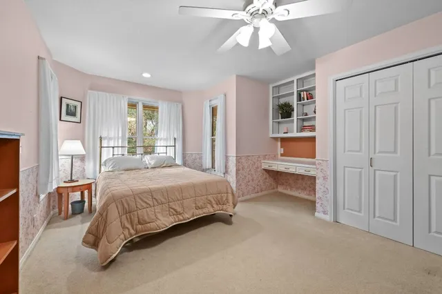 a room with a bed and a chandelier