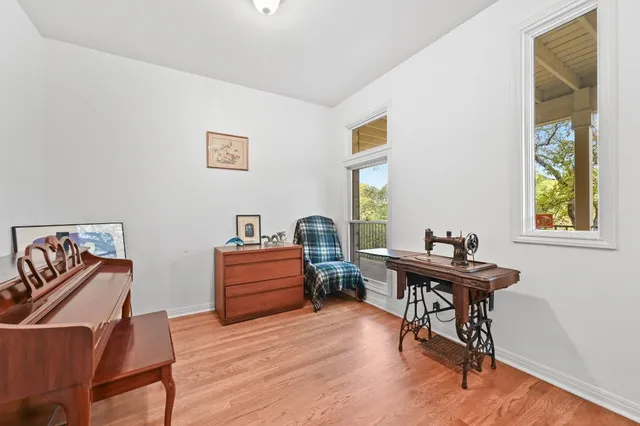 a view of a dining room with furniture wooden floor and chandelier