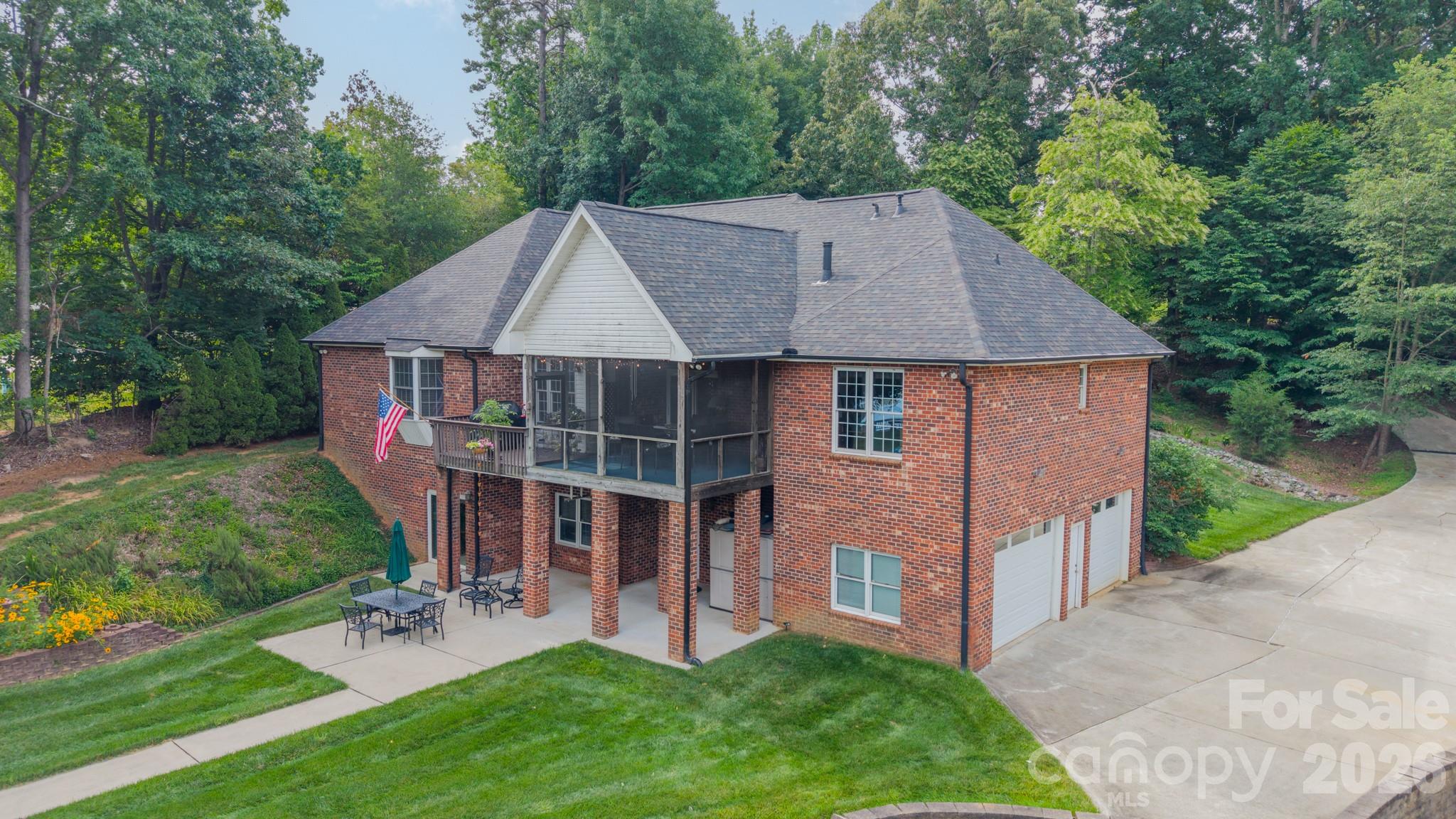 7545 Rabbit Circle Denver, NC 28037 - Photo 3 of 37 a aerial view of a house with a yard potted plants and a bench