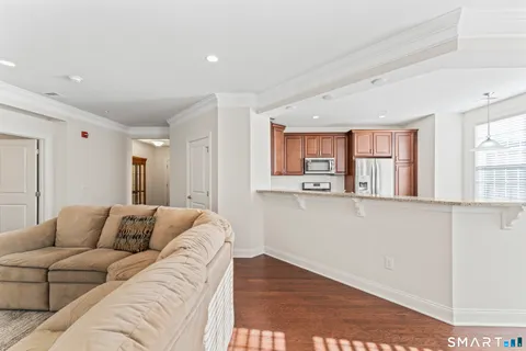 a living room with a couch and a window