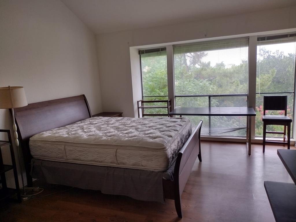 4563 North O'Connor Road, Unit 2298 Irving, TX 75062 - Photo 11 of 12 a bedroom with a bed and a view of chair