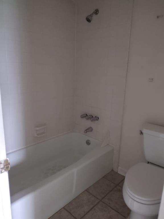 4563 North O'Connor Road, Unit 2298 Irving, TX 75062 - Photo 12 of 12 a white bath tub sitting next to a toilet