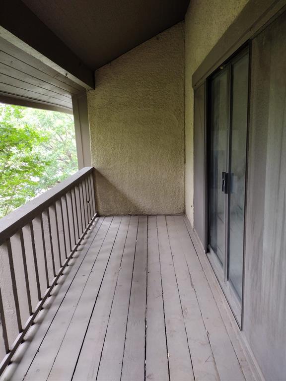 4563 North O'Connor Road, Unit 2298 Irving, TX 75062 - Photo 8 of 12 a view of wooden balcony