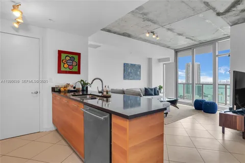 a kitchen with granite countertop a sink and a counter top space