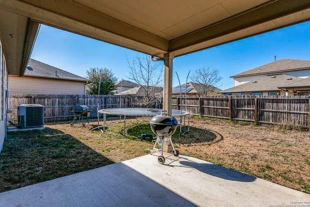 a view of a house with backyard porch and sitting area