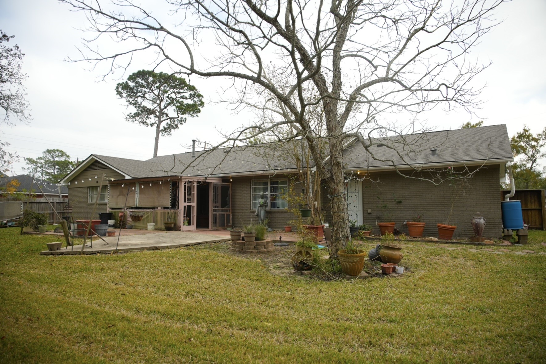 2117 Pecan Street Dickinson, TX 77539 - Photo 12 of 12 a backyard of a house with yard and outdoor seating