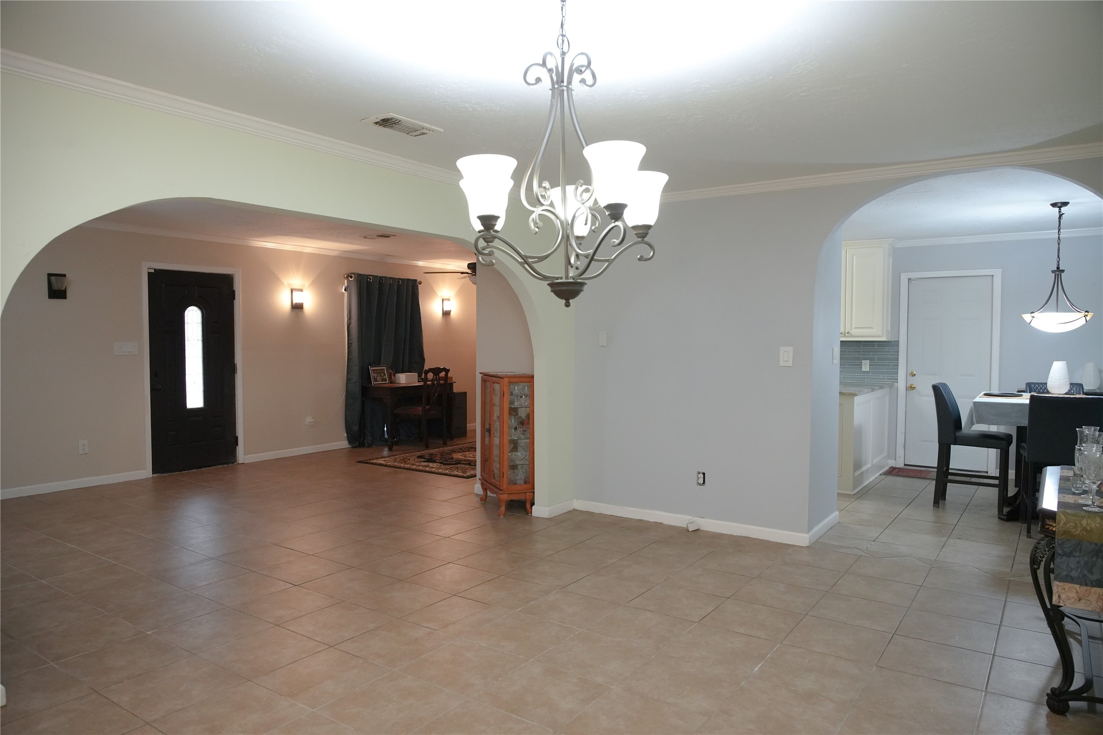 2117 Pecan Street Dickinson, TX 77539 - Photo 4 of 12 a view of a livingroom with a chandelier