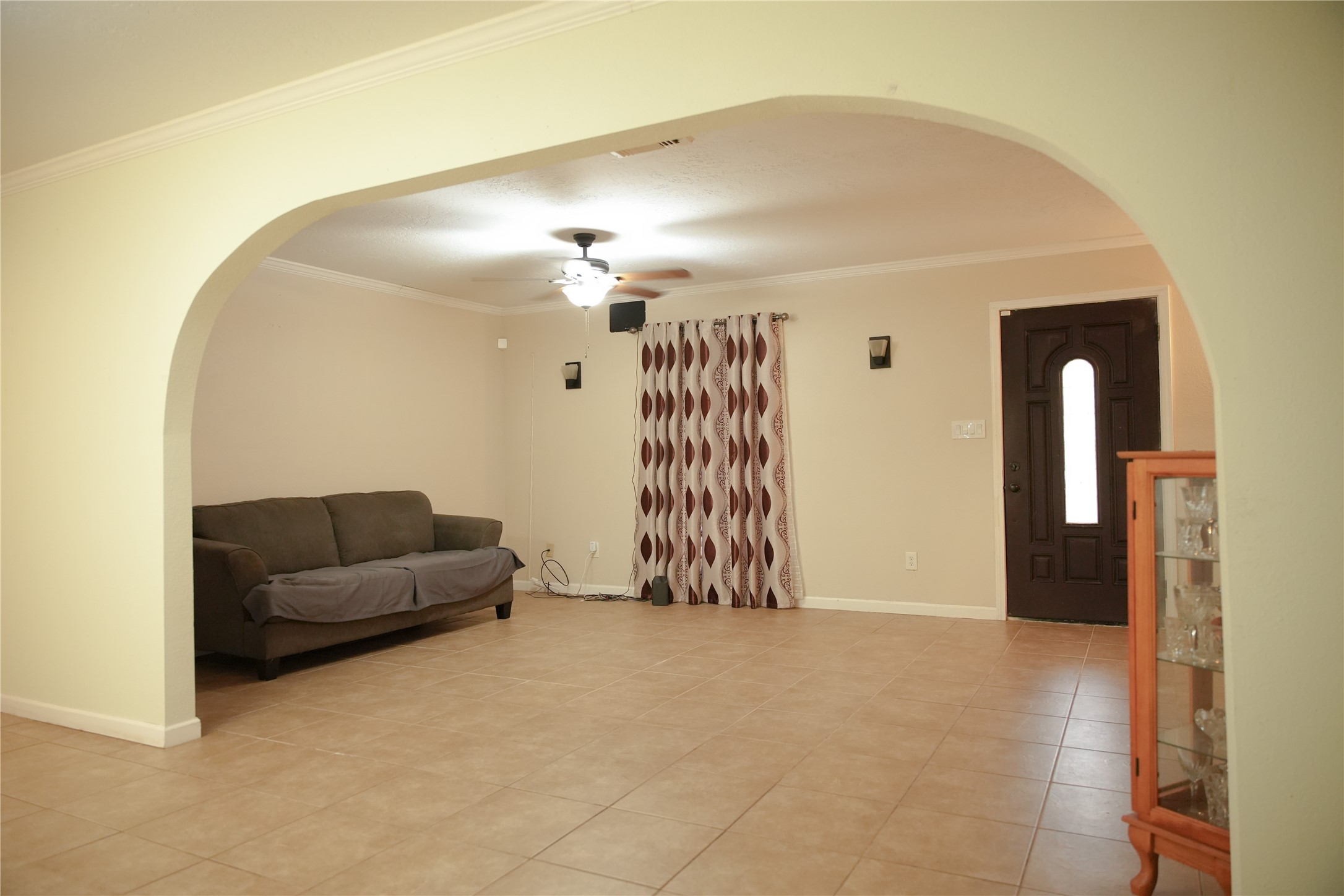 2117 Pecan Street Dickinson, TX 77539 - Photo 5 of 12 a living room with furniture and a chandelier