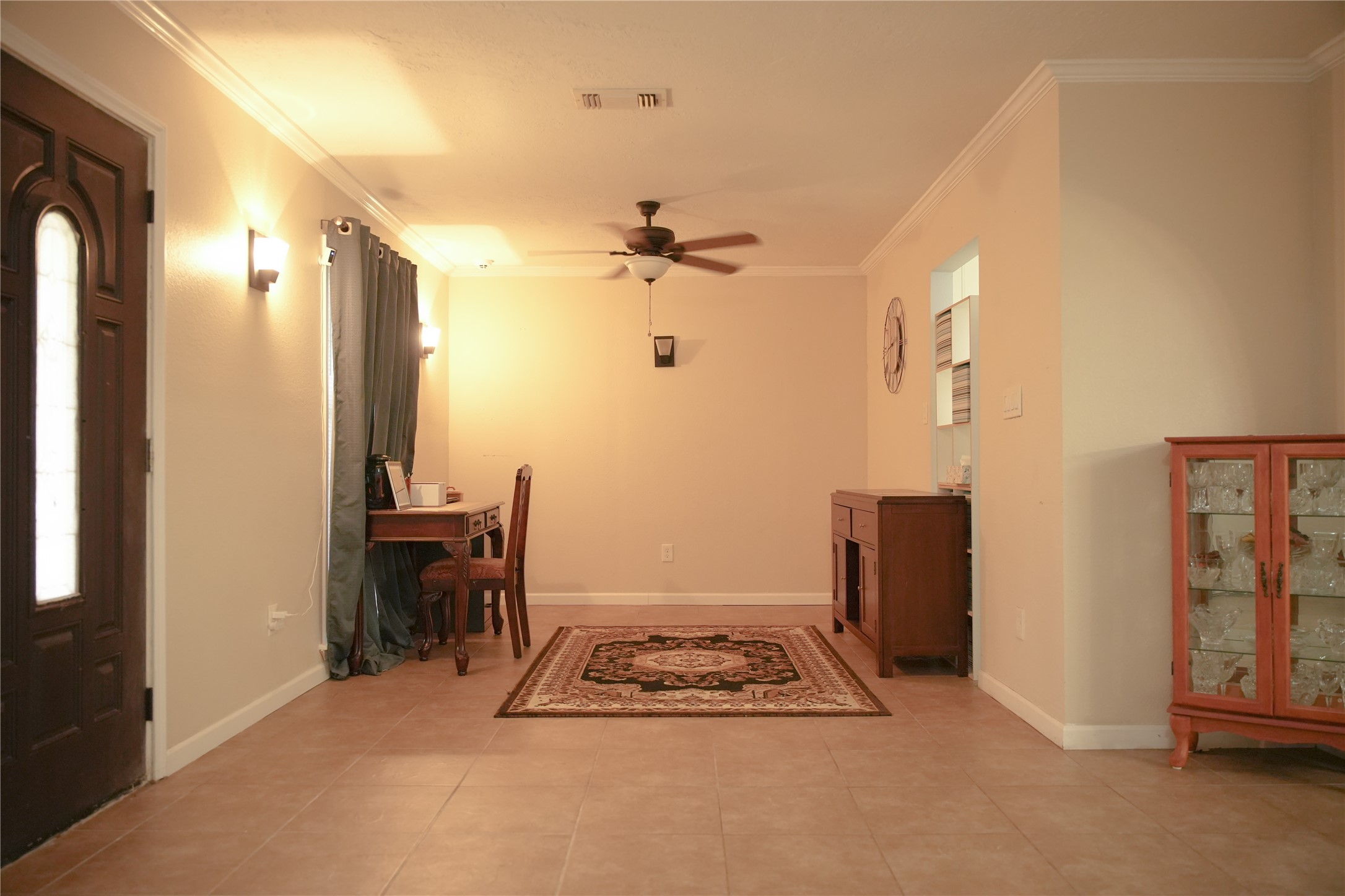 2117 Pecan Street Dickinson, TX 77539 - Photo 6 of 12 a very nice looking room with a dining table chairs and entryway