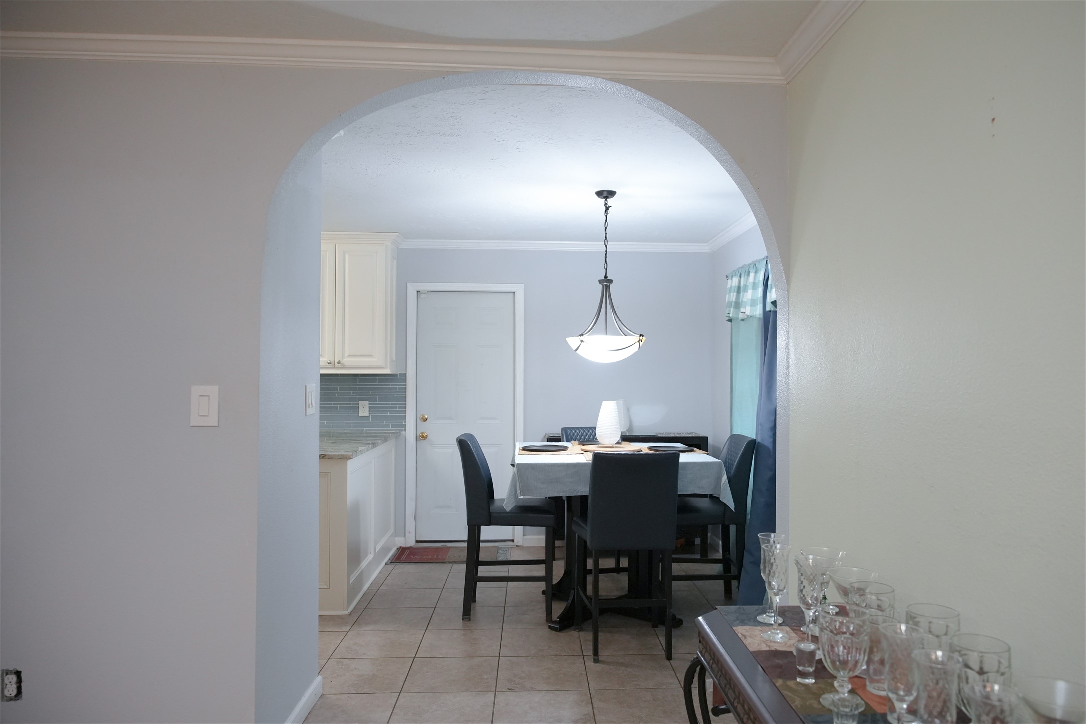 2117 Pecan Street Dickinson, TX 77539 - Photo 9 of 12 a view of a dining room with furniture and wooden floor