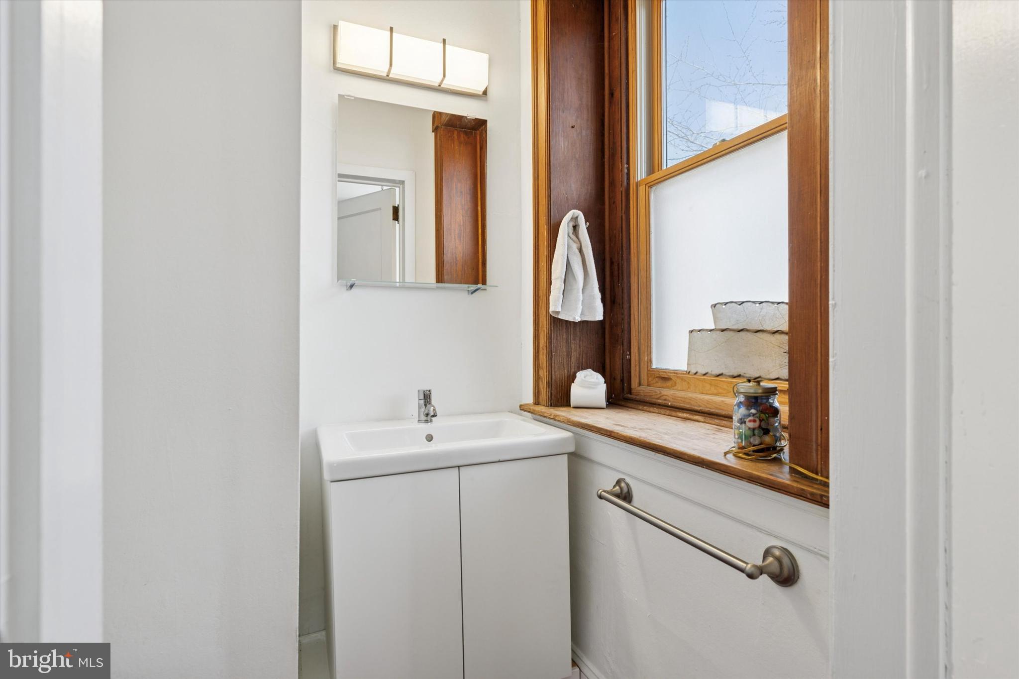 305 Grayling Avenue Narberth, PA 19072 - Photo 13 of 40 a bathroom with a sink and a mirror