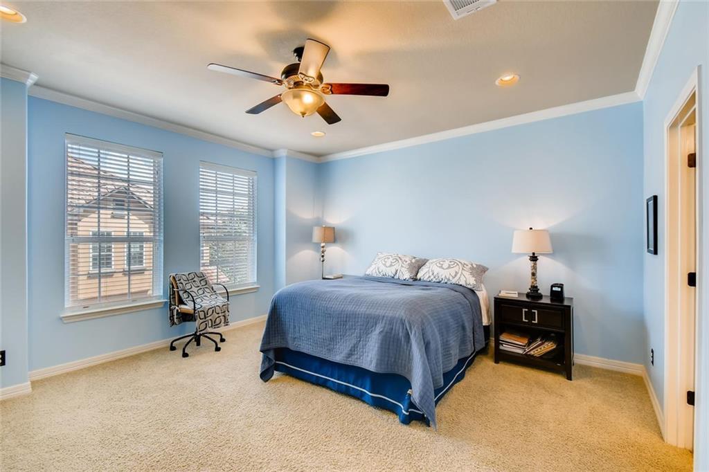 11929 Terraza Circle, Unit TH37 Austin, TX 78726 - Photo 9 of 17 a bedroom with a bed furniture and a window
