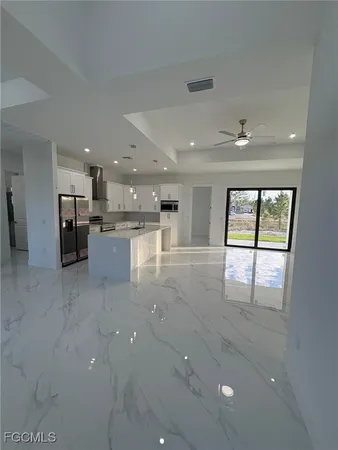 a view of a kitchen with furniture and a window