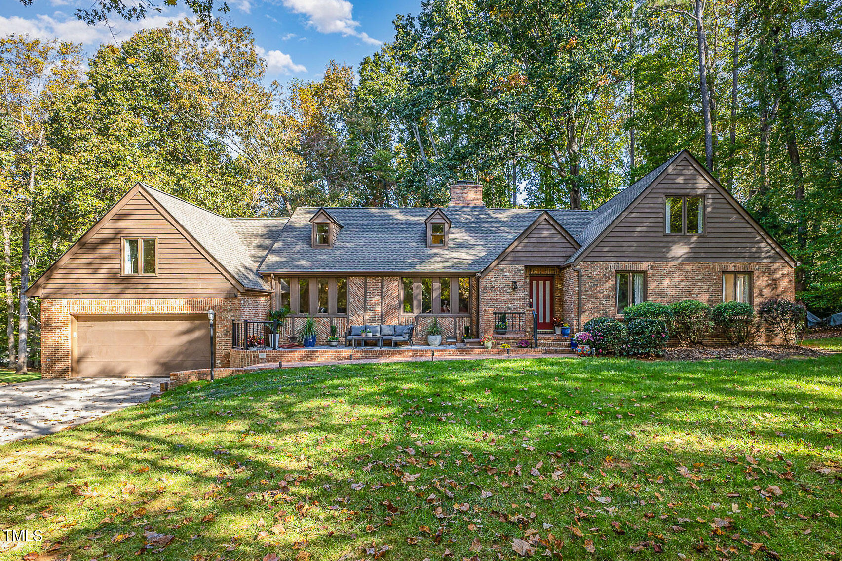 816 Thatcher Way Raleigh, NC 27615 - Photo 1 of 53 a front view of a house with a garden and trees