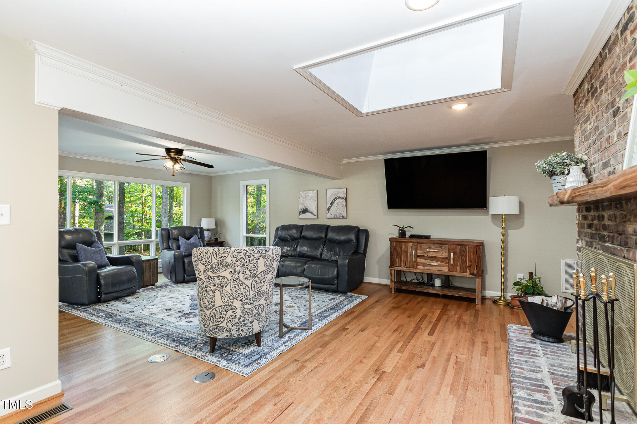 816 Thatcher Way Raleigh, NC 27615 - Photo 15 of 53 a living room with furniture a flat screen tv and a fireplace