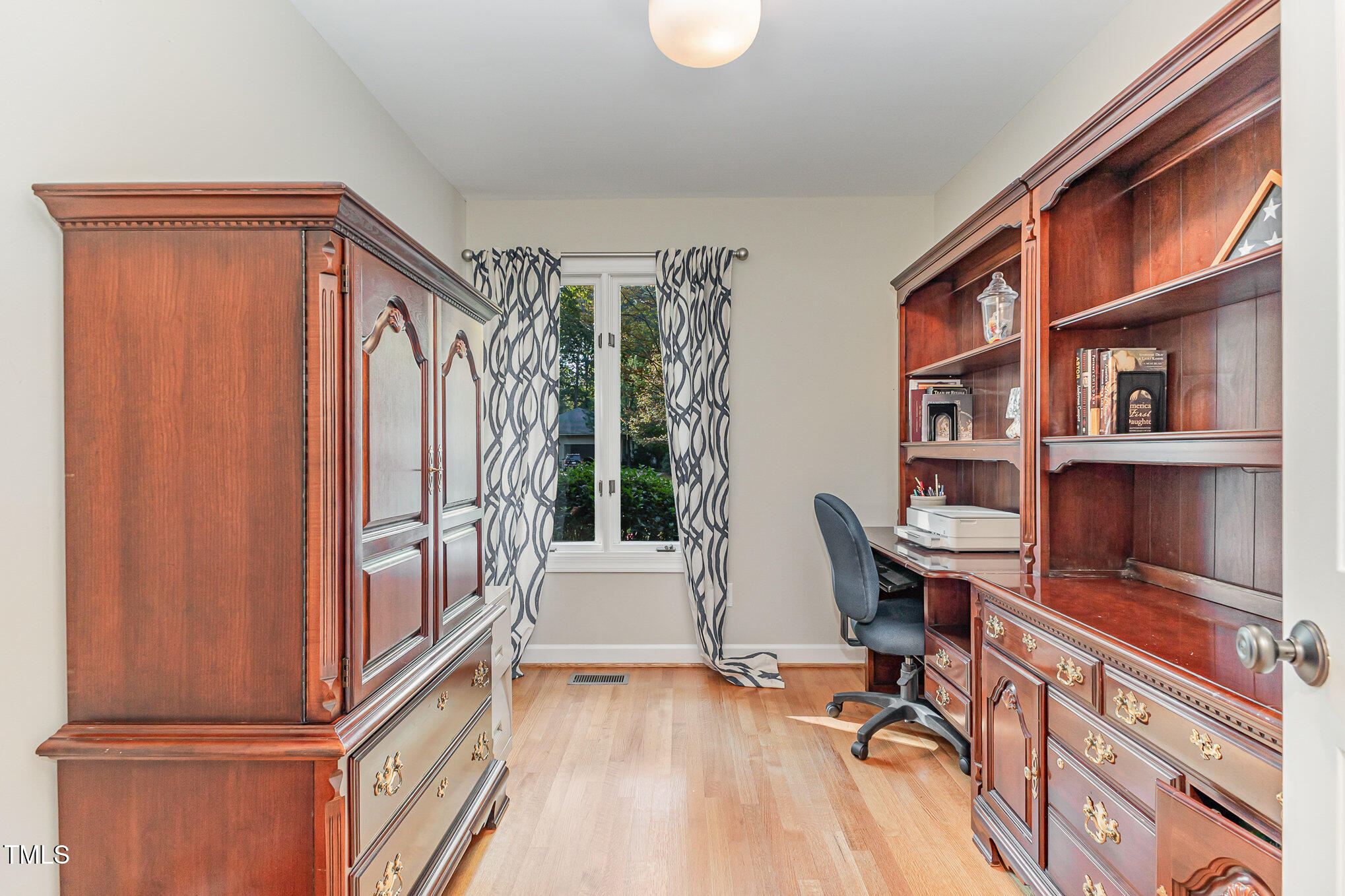 816 Thatcher Way Raleigh, NC 27615 - Photo 20 of 53 a view of a workspace with furniture and a window