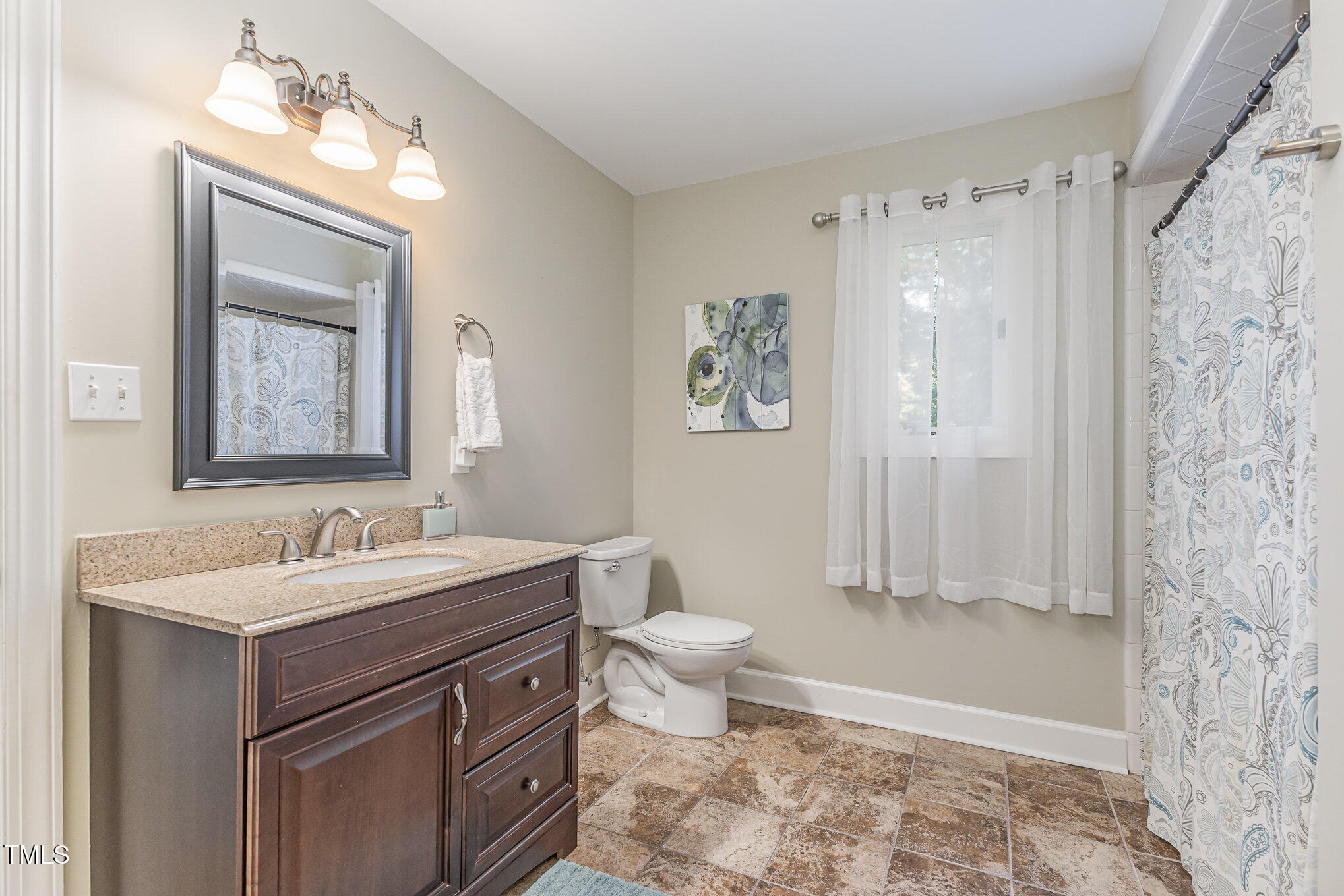 816 Thatcher Way Raleigh, NC 27615 - Photo 22 of 53 a bathroom with a toilet sink and mirror