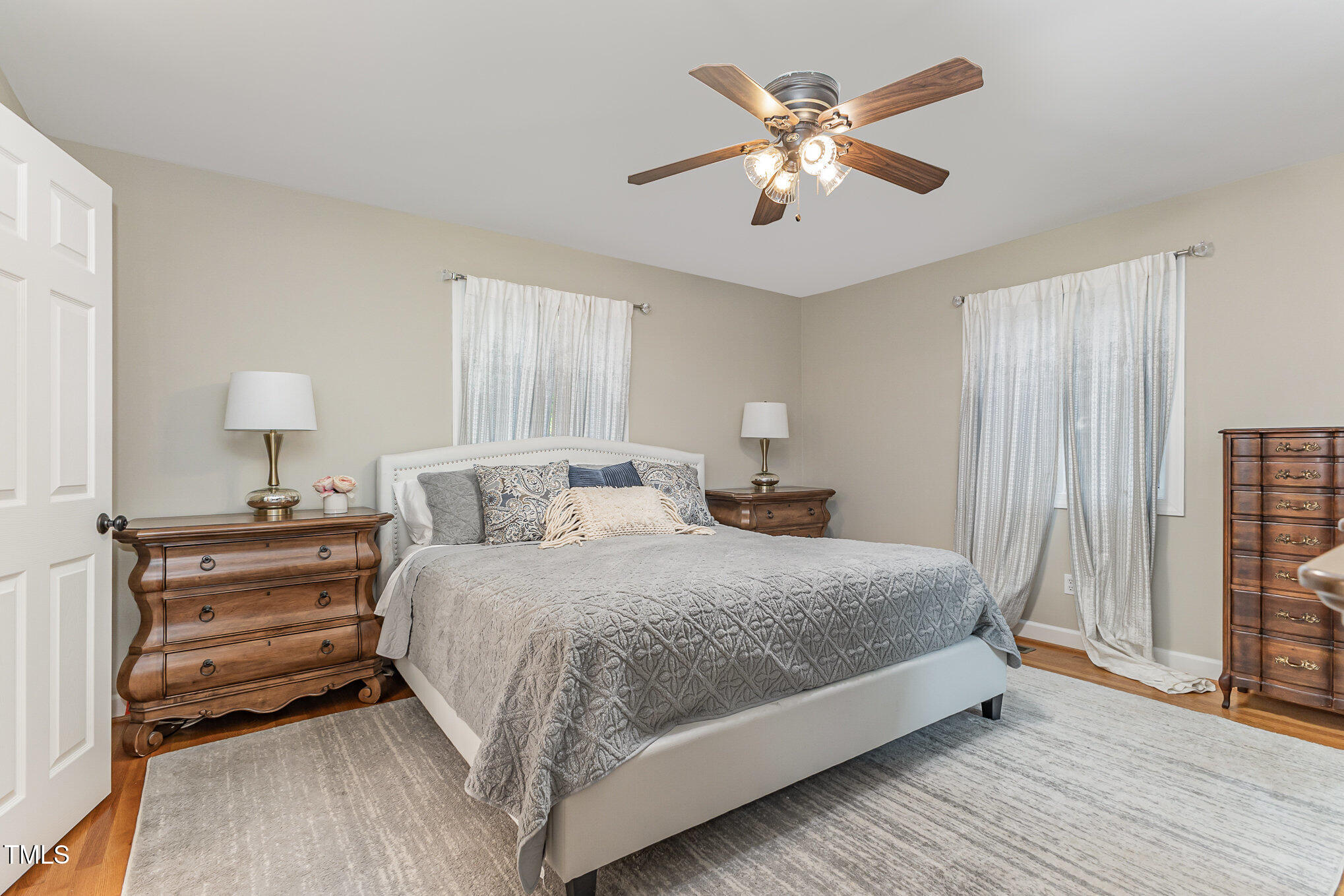 816 Thatcher Way Raleigh, NC 27615 - Photo 23 of 53 a bedroom with a large bed chandelier and a window