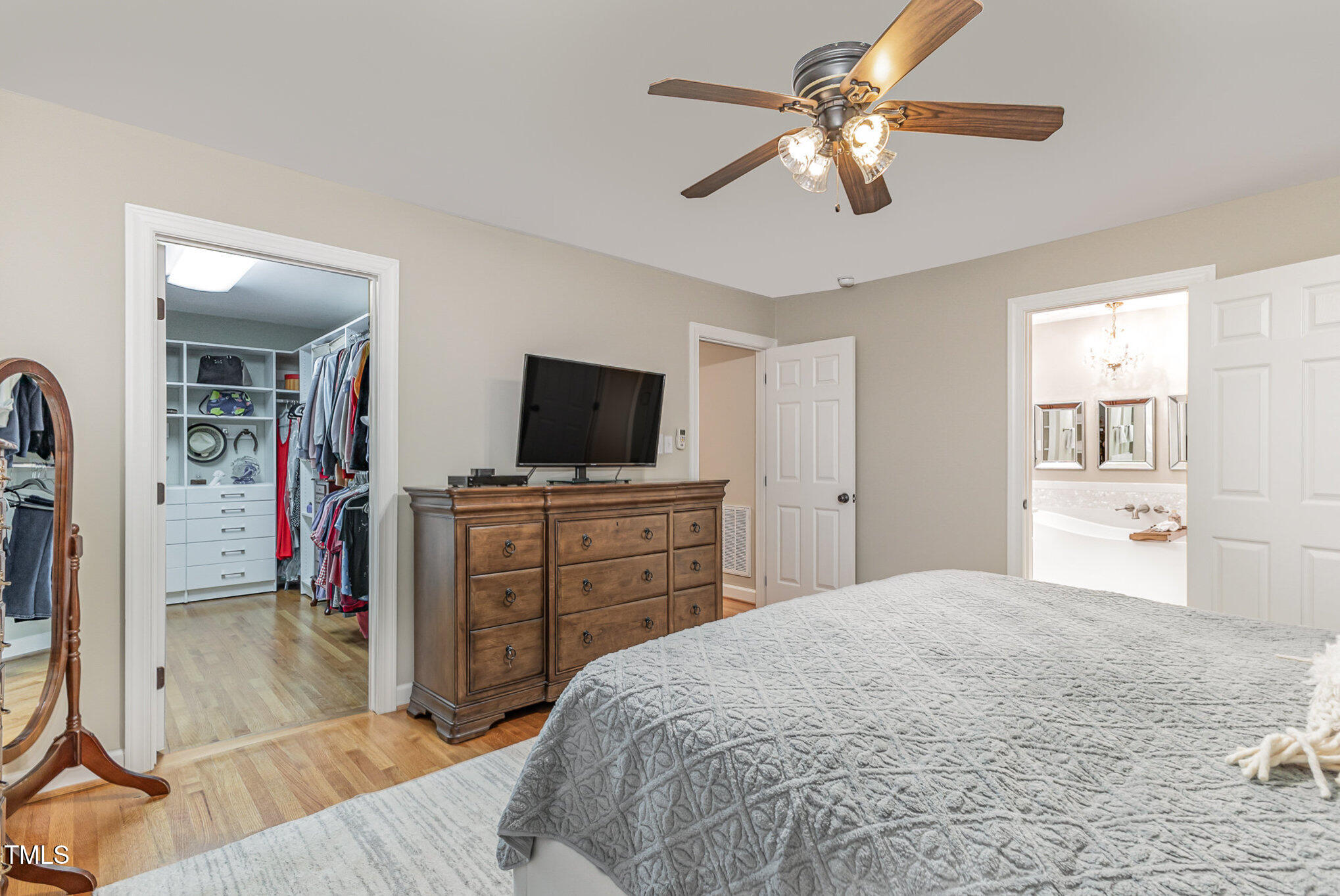 816 Thatcher Way Raleigh, NC 27615 - Photo 24 of 53 a bedroom with a bed and a flat tv screen on dresser