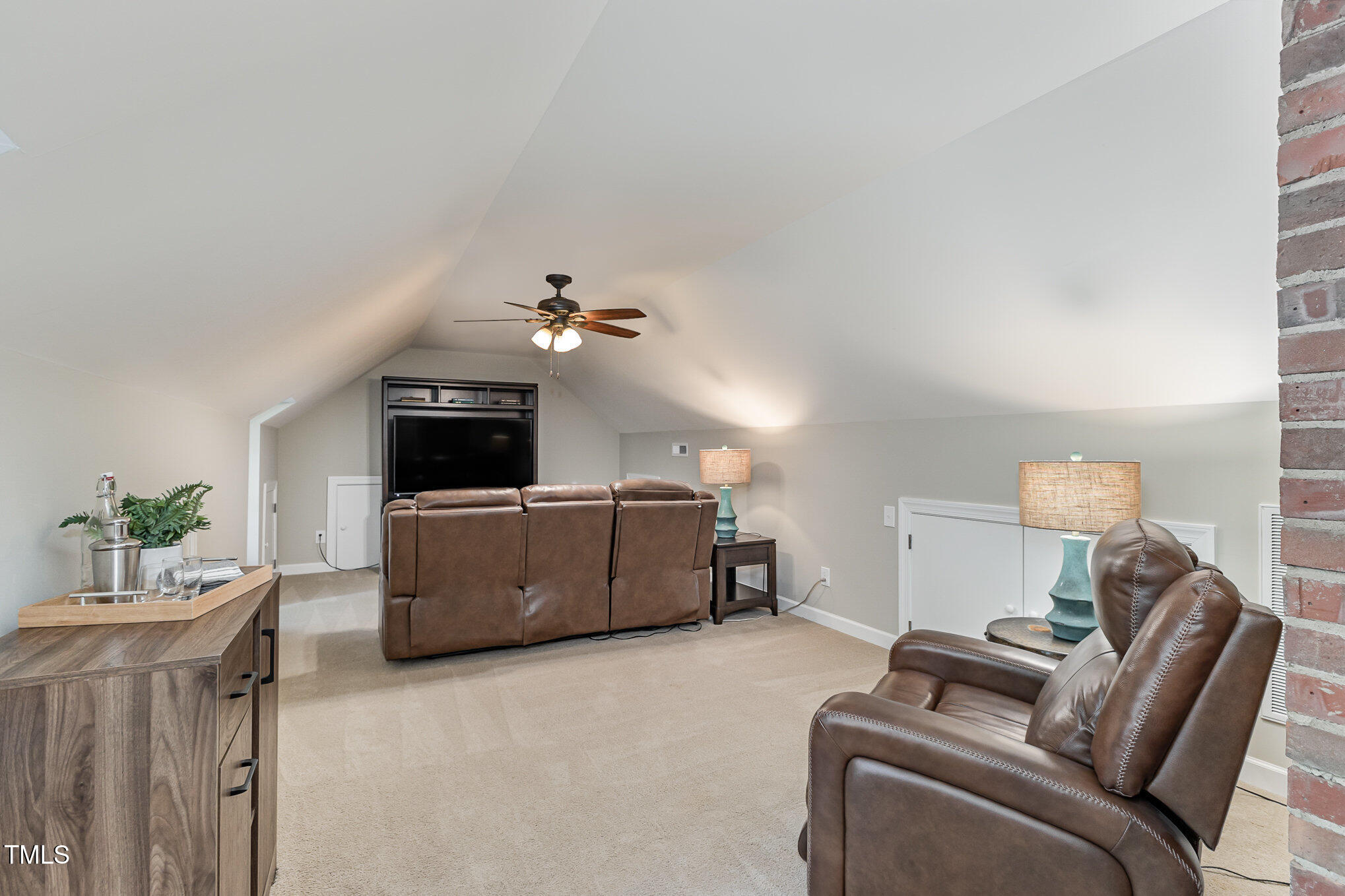 816 Thatcher Way Raleigh, NC 27615 - Photo 31 of 53 a living room with furniture and a flat screen tv