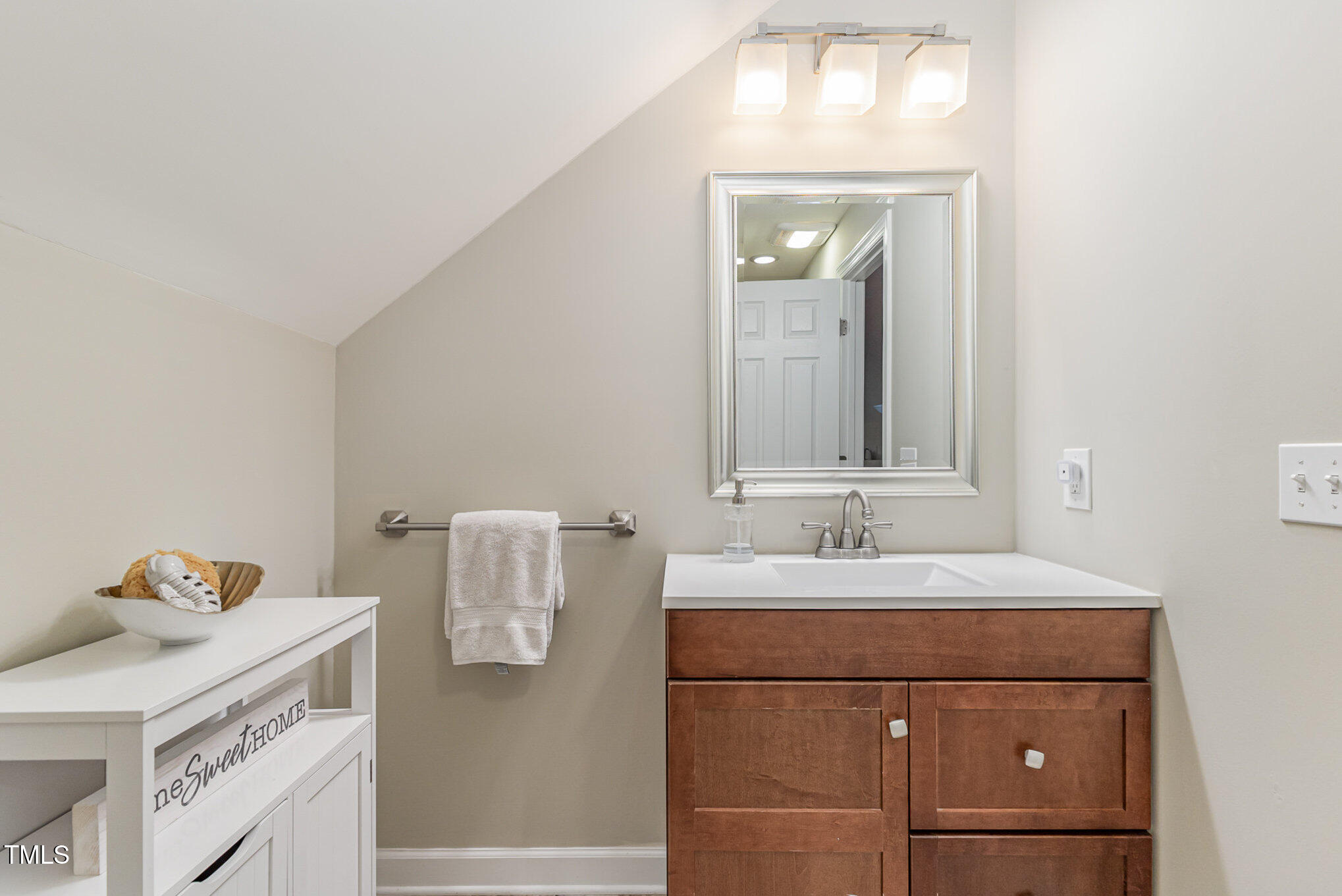 816 Thatcher Way Raleigh, NC 27615 - Photo 36 of 53 a bathroom with a sink and a mirror