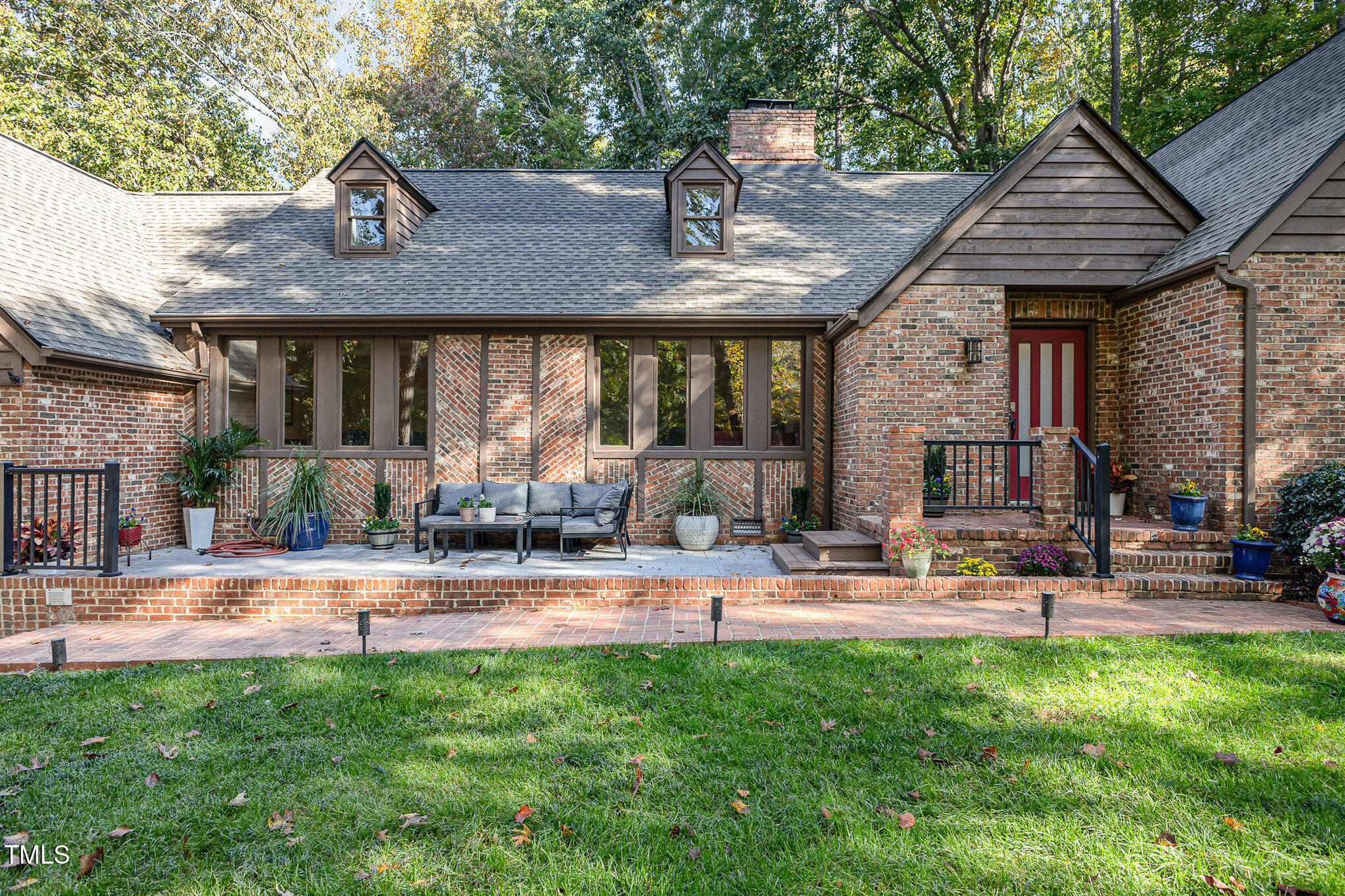 816 Thatcher Way Raleigh, NC 27615 - Photo 42 of 53 a patio with a table and chairs and potted plants