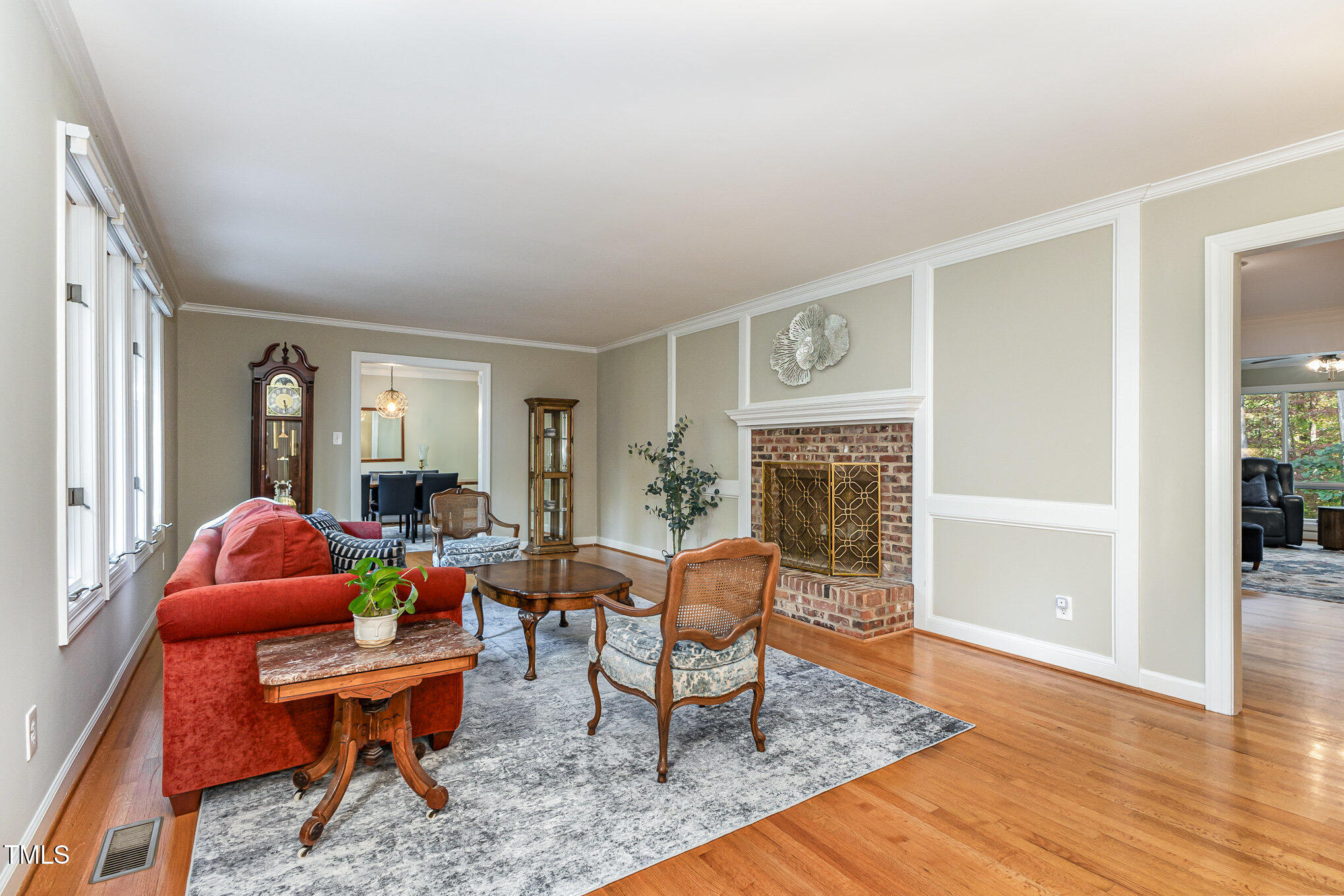 816 Thatcher Way Raleigh, NC 27615 - Photo 6 of 53 a living room with furniture a fireplace and wooden floor