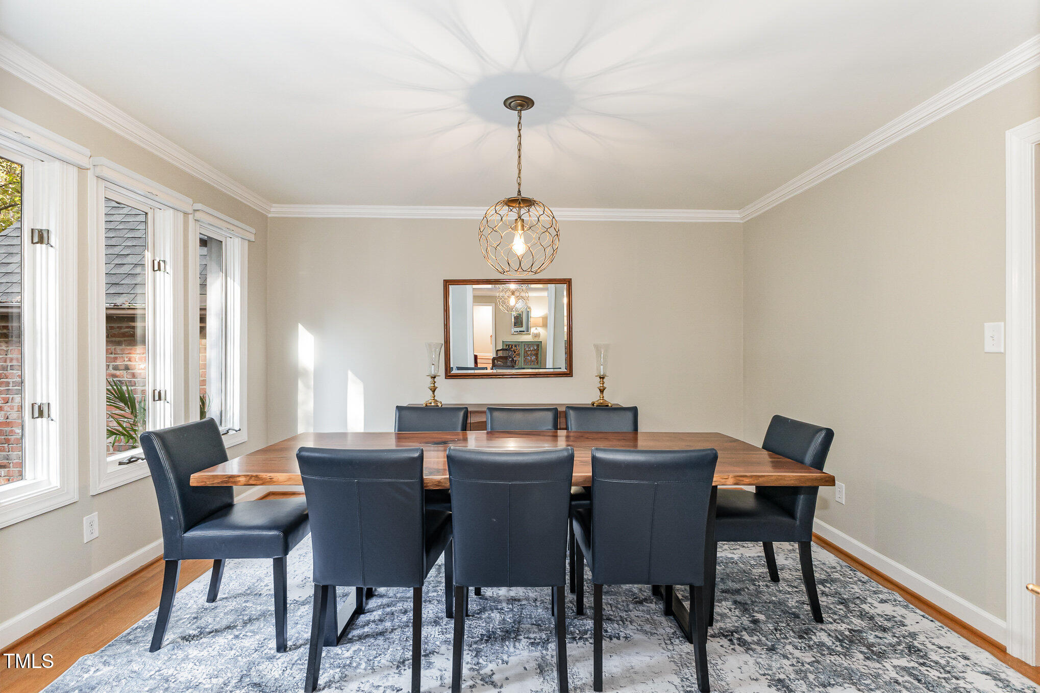 816 Thatcher Way Raleigh, NC 27615 - Photo 8 of 53 a dining room with furniture a chandelier and window