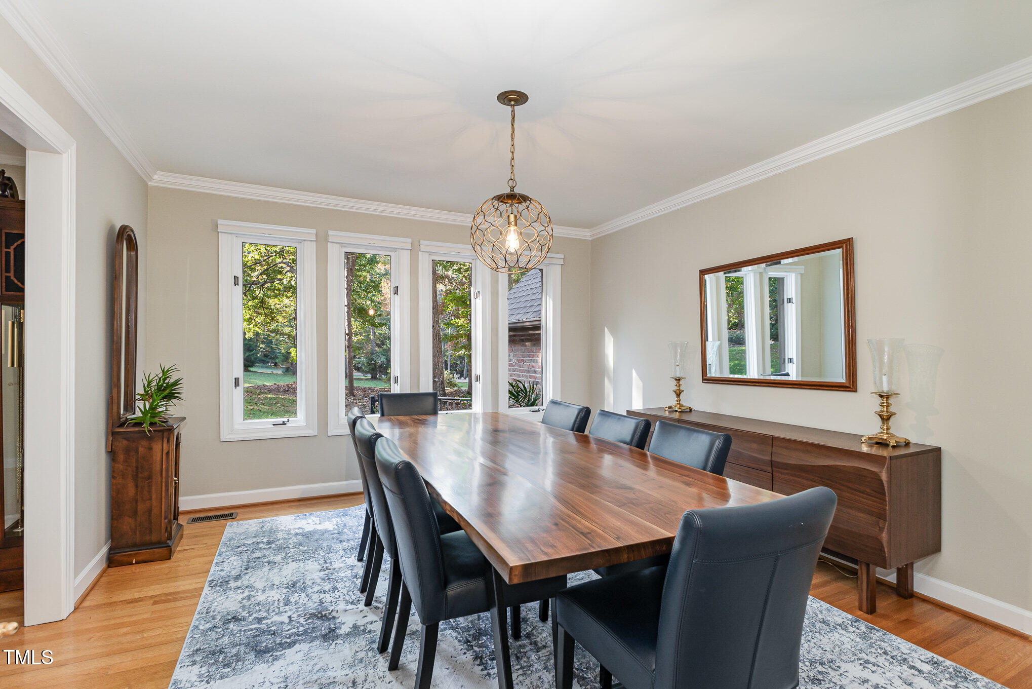 816 Thatcher Way Raleigh, NC 27615 - Photo 9 of 53 a dining room with furniture window wooden floor