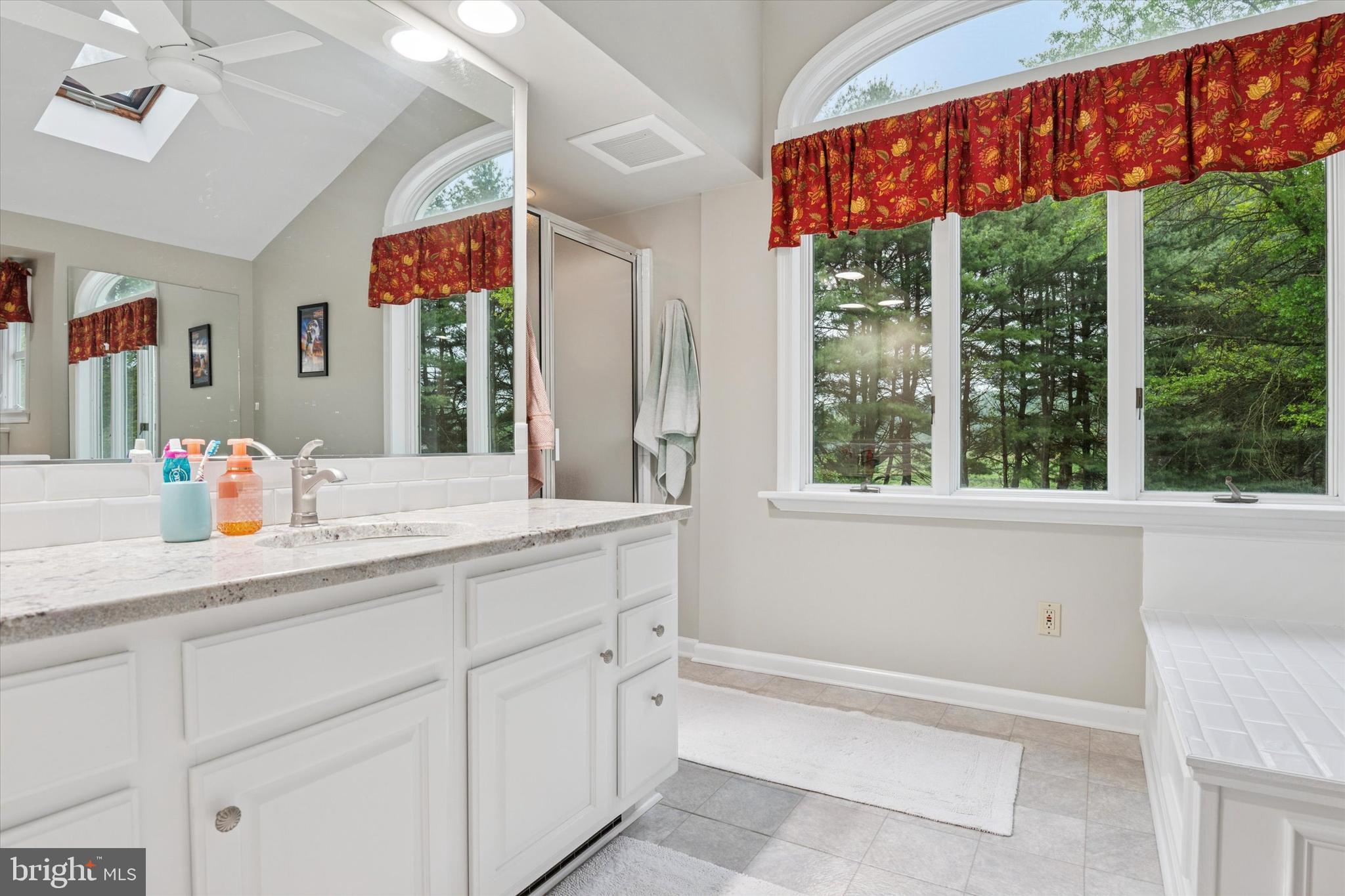 227 Parsons Road Landenberg, PA 19350 - Photo 19 of 40 a bathroom with a granite countertop sink and mirror