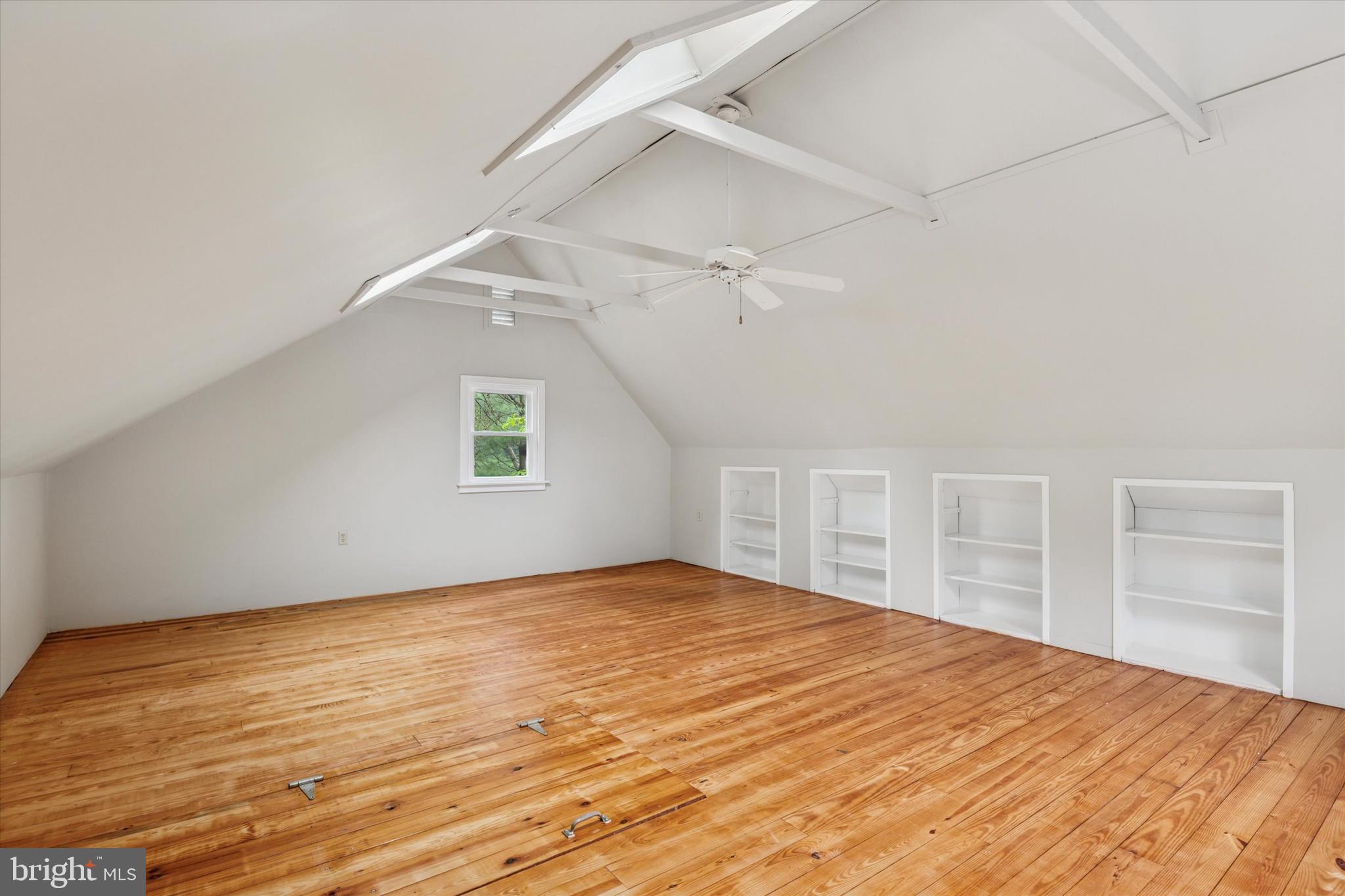 227 Parsons Road Landenberg, PA 19350 - Photo 27 of 40 a view of an empty room with wooden floor and a window