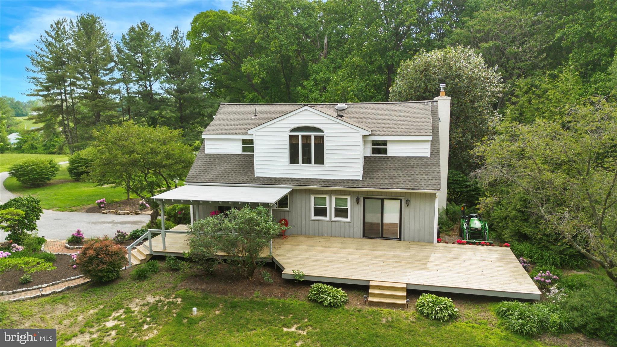 227 Parsons Road Landenberg, PA 19350 - Photo 33 of 40 a view of house with yard and outdoor seating