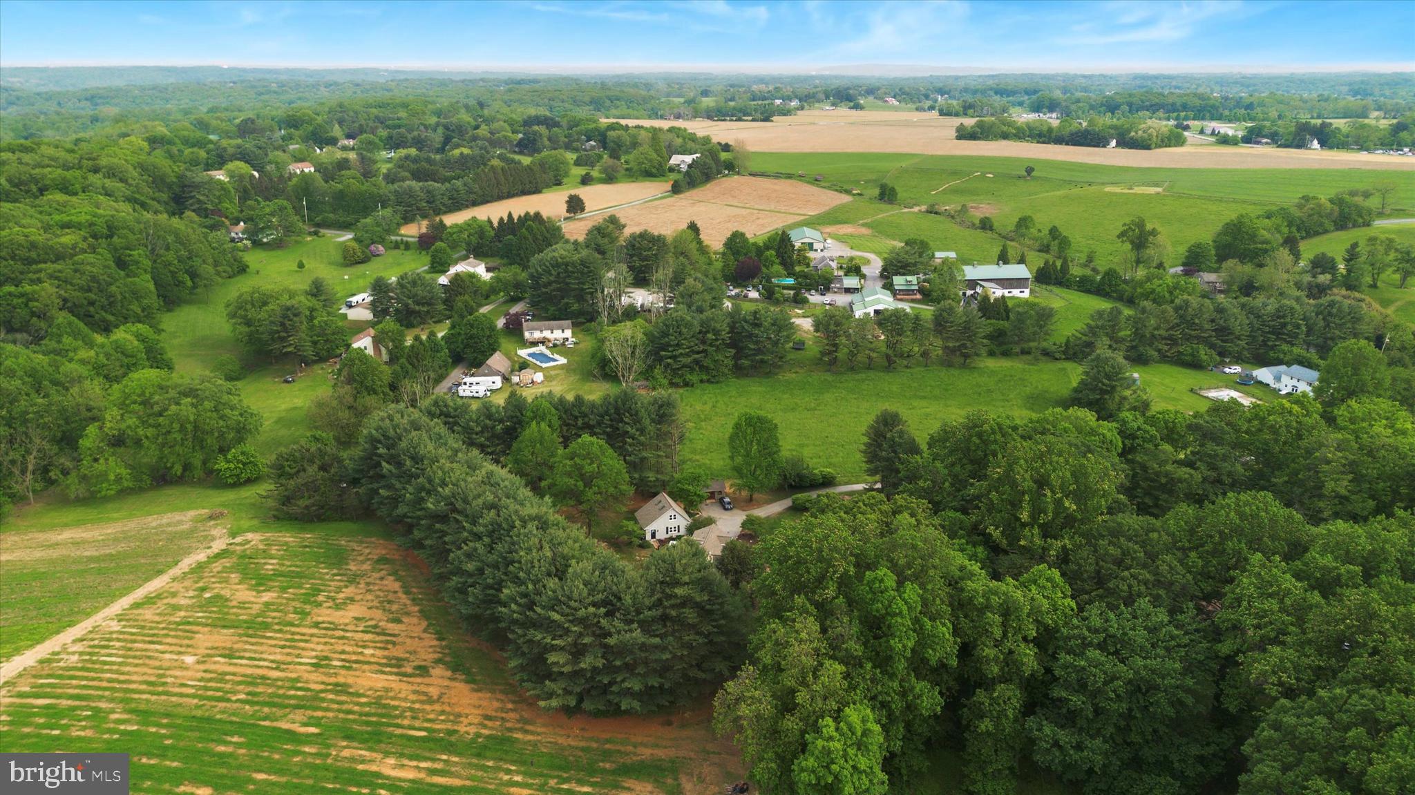 227 Parsons Road Landenberg, PA 19350 - Photo 39 of 40 a view of a city with lush green forest