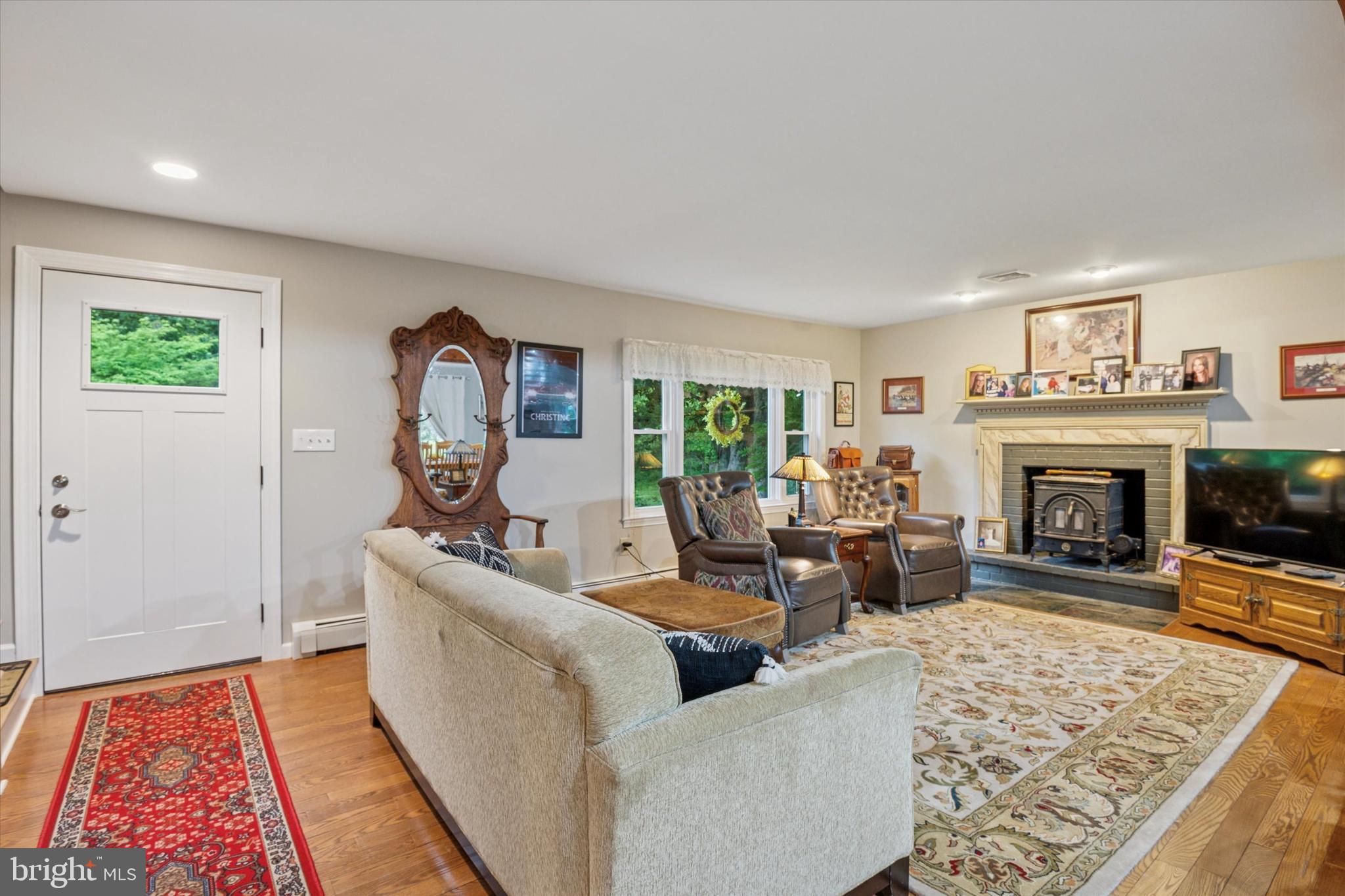 227 Parsons Road Landenberg, PA 19350 - Photo 6 of 40 a living room with furniture and a fireplace