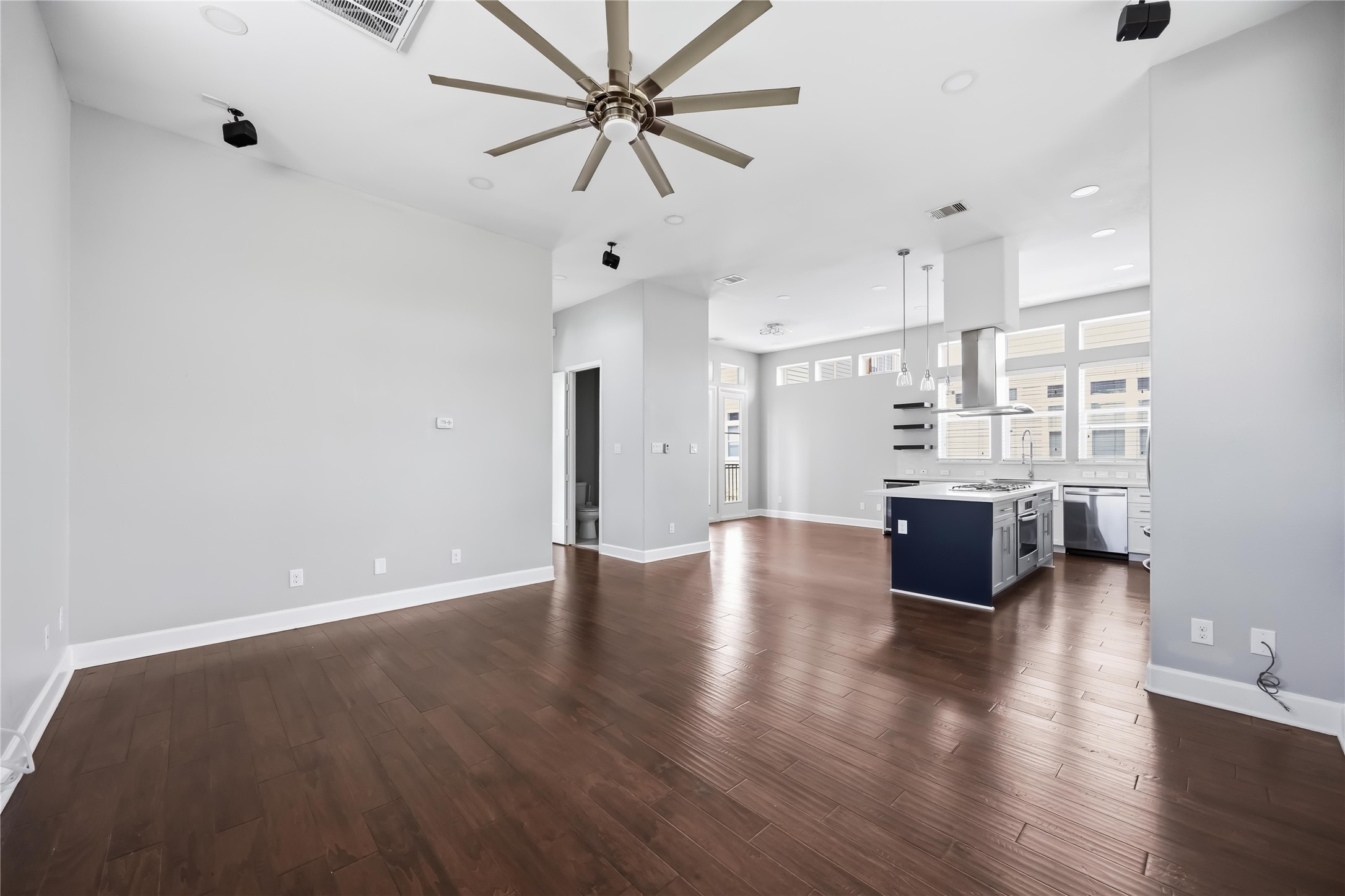 708 Schwartz Street Houston, TX 77020 - Photo 14 of 25 a view of kitchen and with a ceiling fan wooden floor