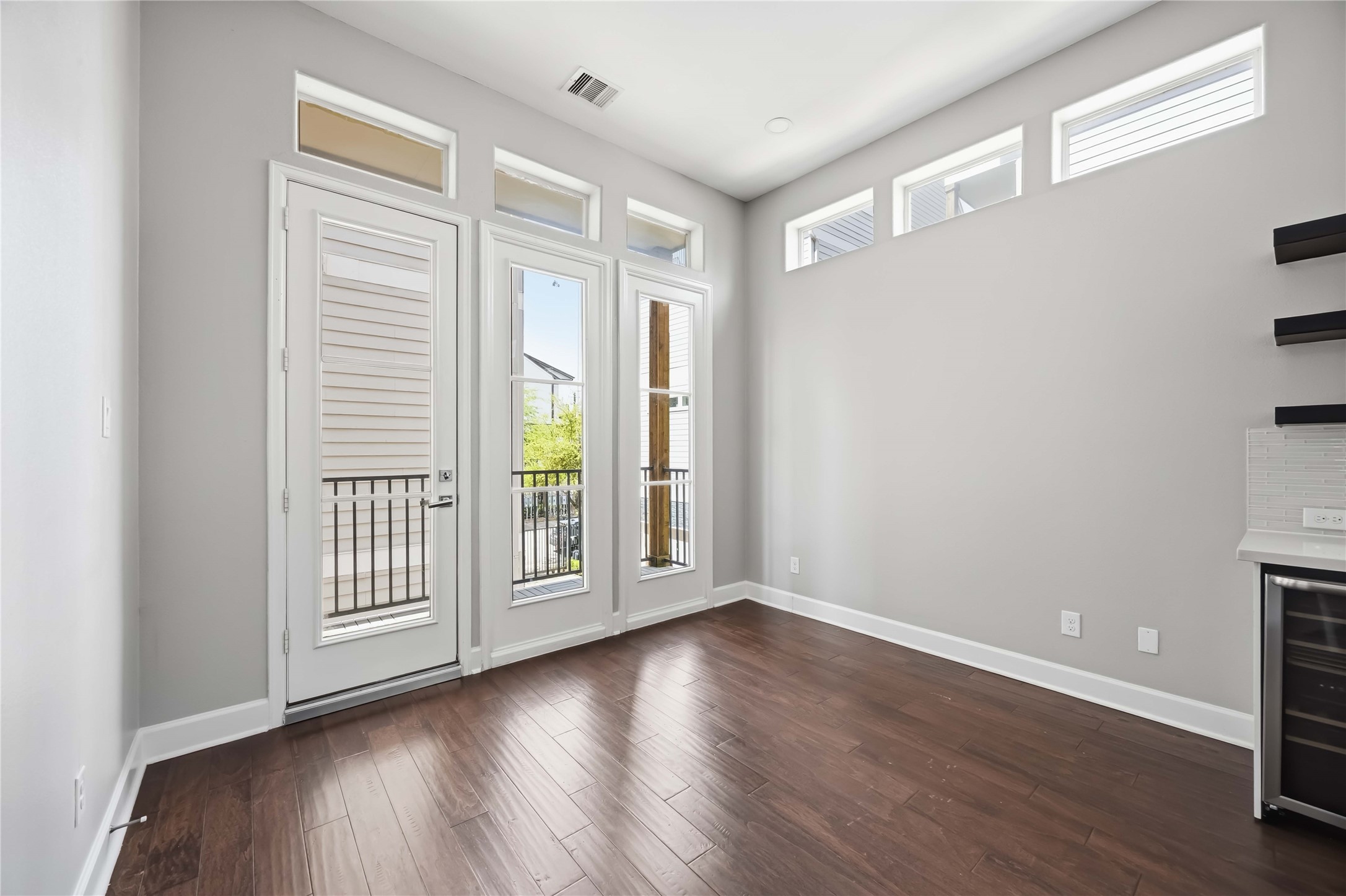 708 Schwartz Street Houston, TX 77020 - Photo 9 of 25 wooden floor in an empty room with a window