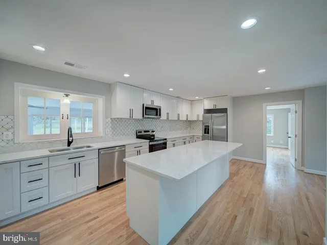 a large kitchen with cabinets