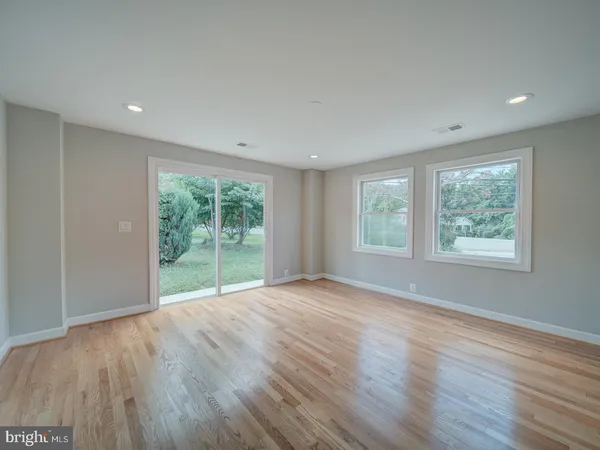 a bathroom with a double vanity sink mirror and toilet