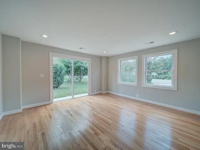 a bathroom with a double vanity sink mirror and toilet