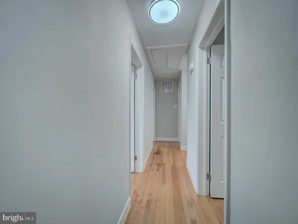 a bathroom with a toilet a sink and a window