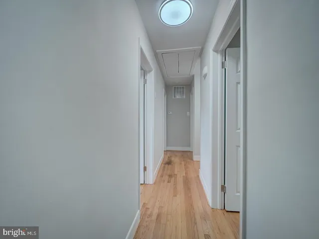 a bathroom with a toilet a sink and a window