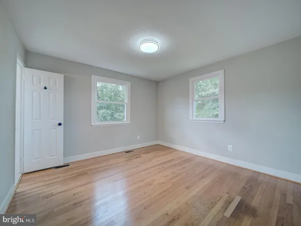 a bathroom with a toilet a sink and shower