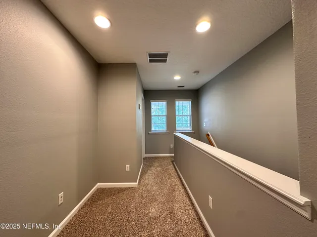 a view of hallway with window