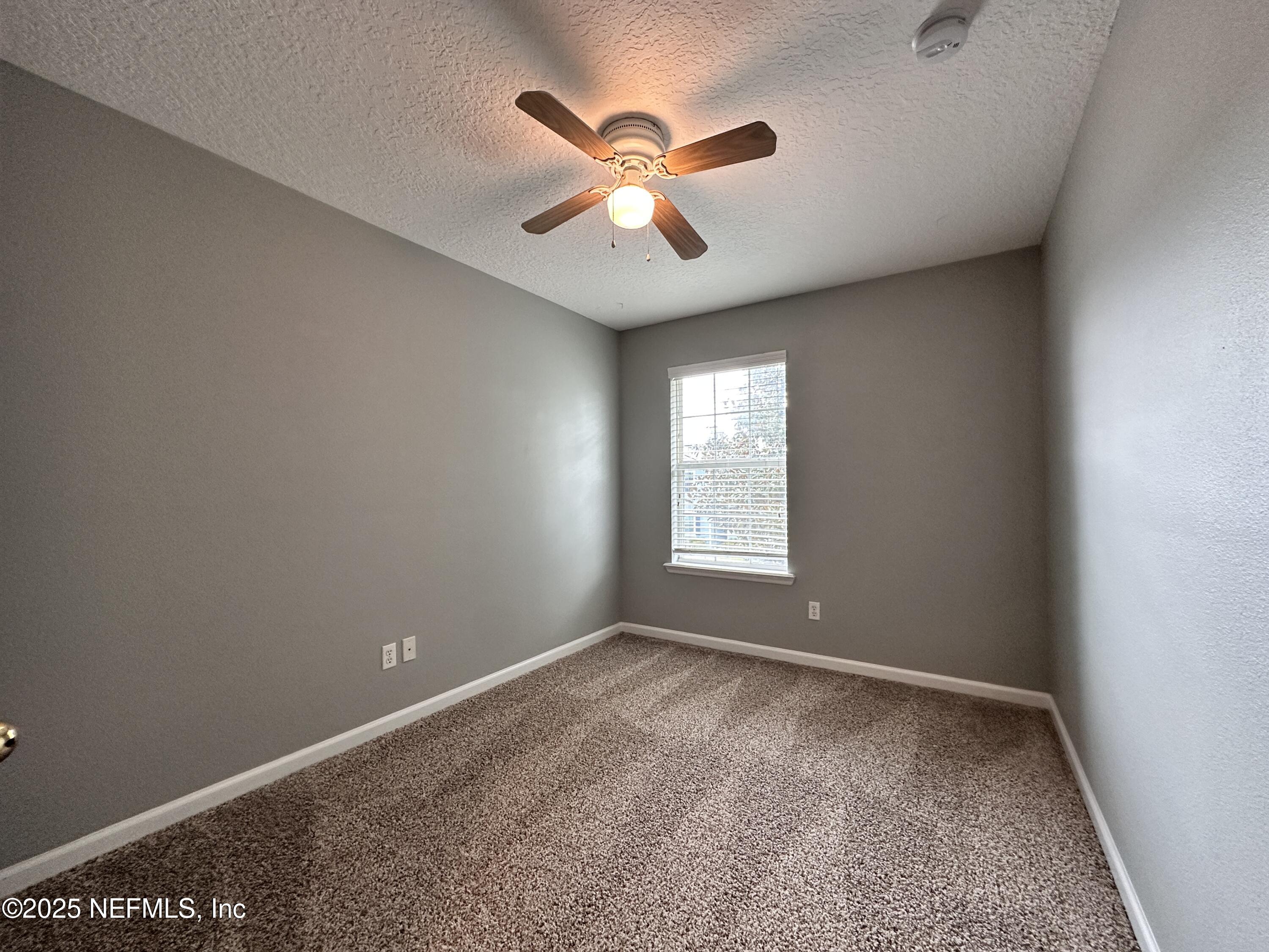3730 Creswick Circle, Unit 5 Orange Park, FL 32065 - Photo 15 of 18 a view of room with window and ceiling fan