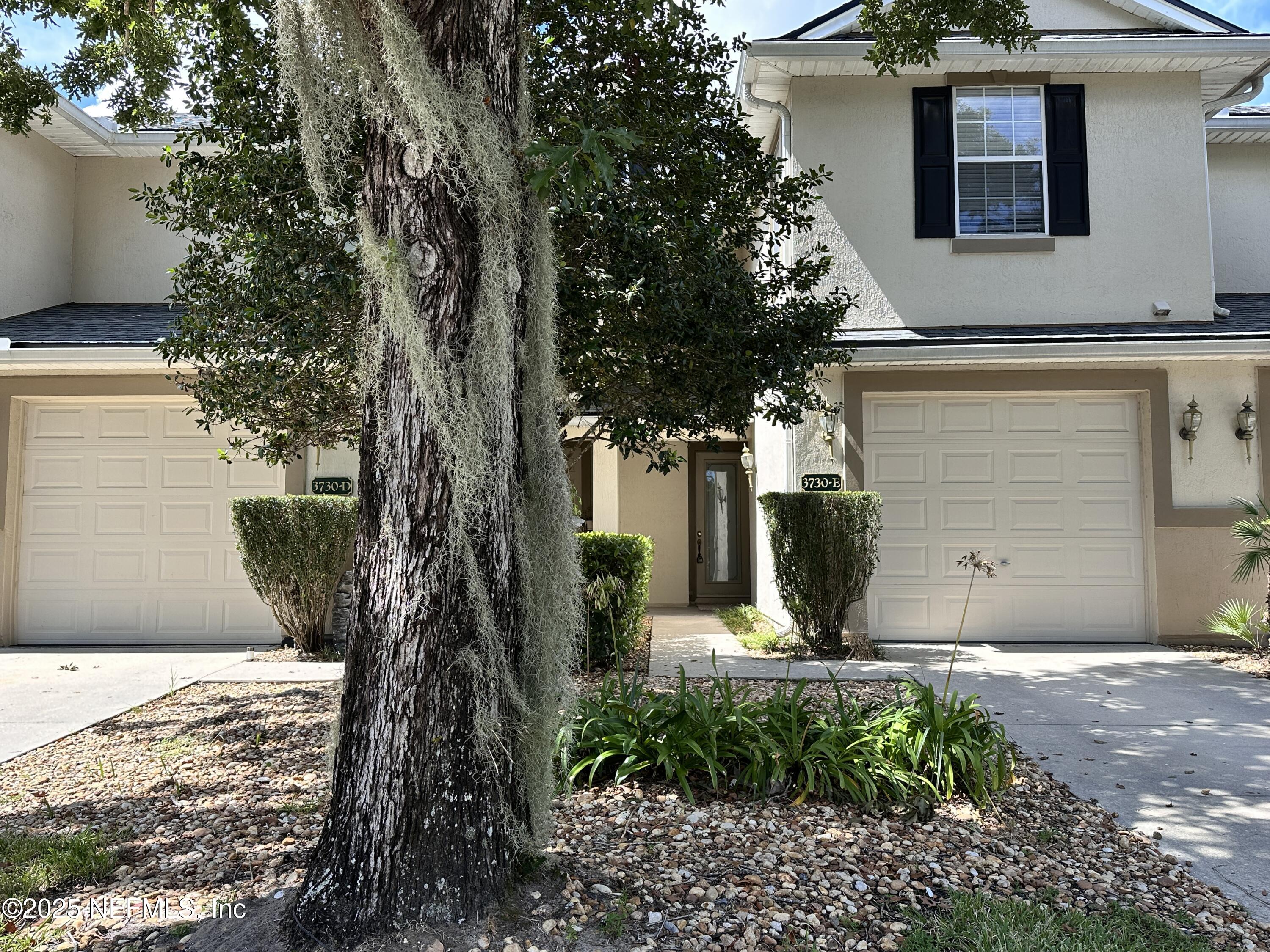 3730 Creswick Circle, Unit 5 Orange Park, FL 32065 - Photo 2 of 18 a front view of a house with garden
